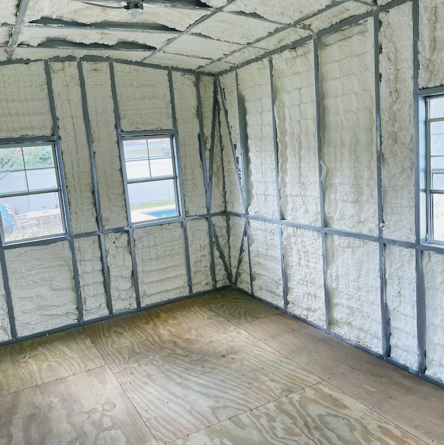 Closed-cell spray foam insulation applied to wall cavities in a residential project in Cecil